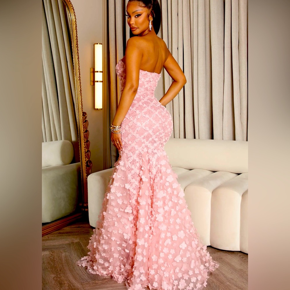 Pink gown that could be great for prom or a bride .